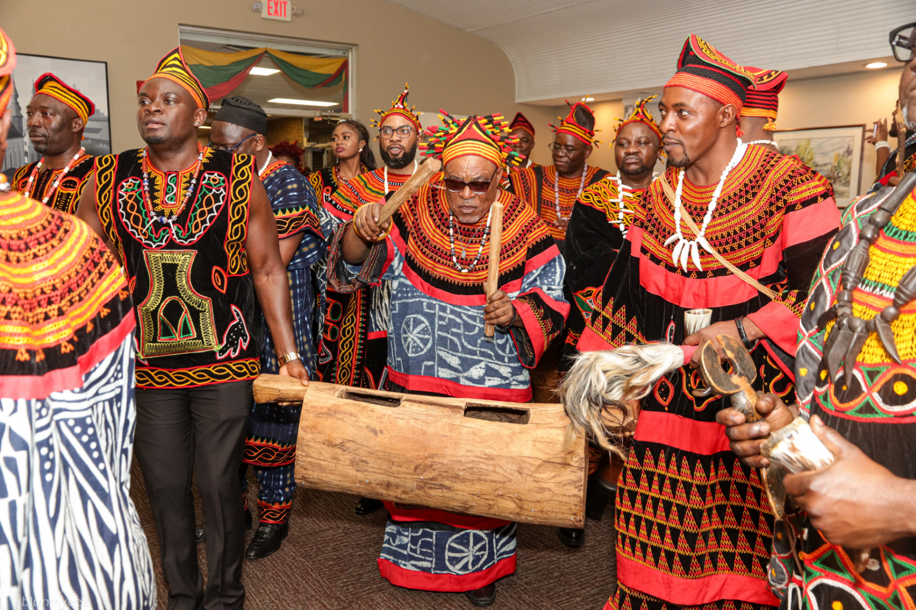 Delegation entering the hall with drums and horns