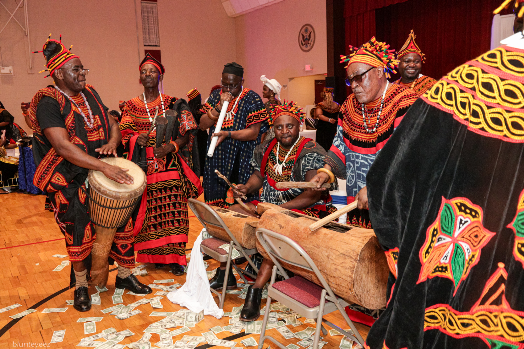 Musicians performing on traditional drums and horns